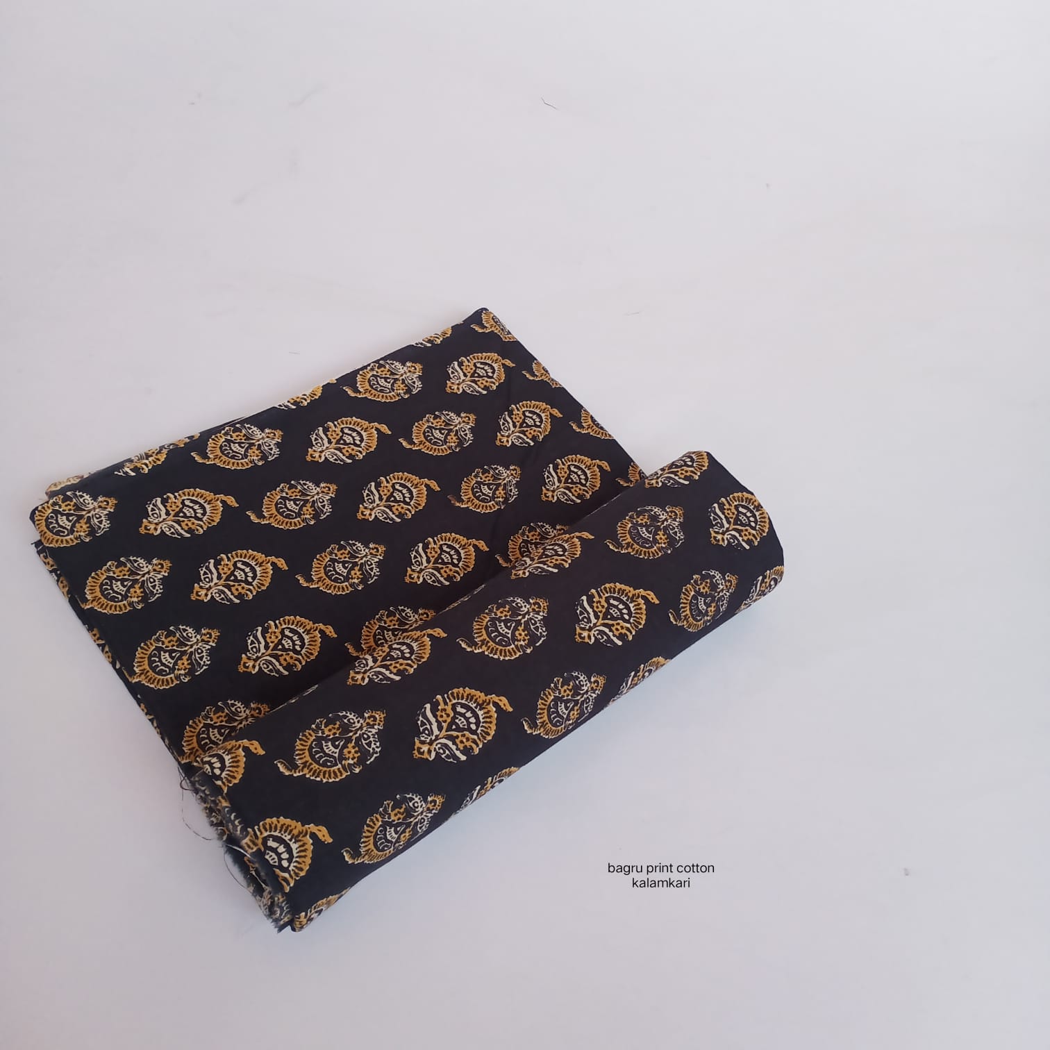 Black Bagru handblock cotton fabric featuring floral butti design, handcrafted wholesale fabric from Fabtexs